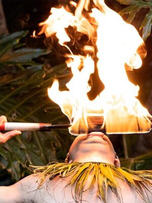 A Polynesian dancer performing a fire show at the Catamaran Resort Hotel and Spa by Pacific Beach, San Diego, CA